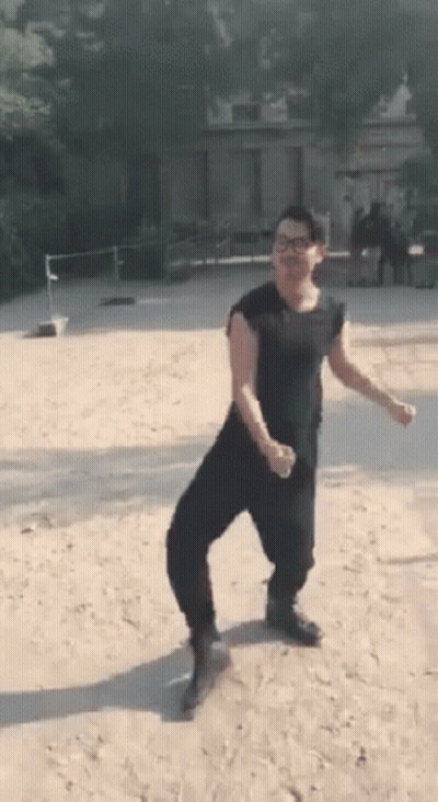 Man In Black Shirt And Pants On Sandy Field GIF
