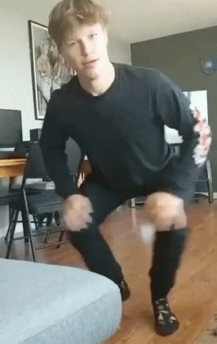 Man In Black Shirt And Pants Squatting GIF