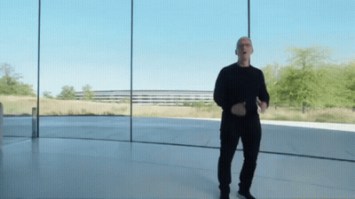 Man In Black Shirt And Pants Standing Before Glass Wall GIF