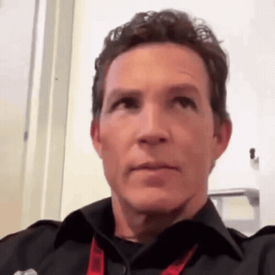 Man In Black Shirt And Red Lanyard GIF