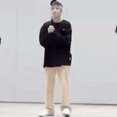 Man In Black Shirt And Tan Pants GIF