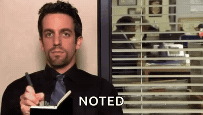 Man In Black Shirt And Tie Holding Pen And Notebook GIF