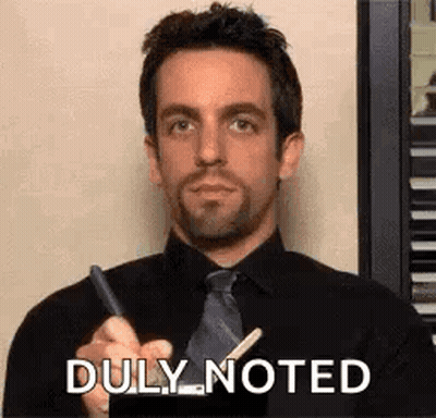 Man In Black Shirt And Tie Holding Pen And Stick GIF