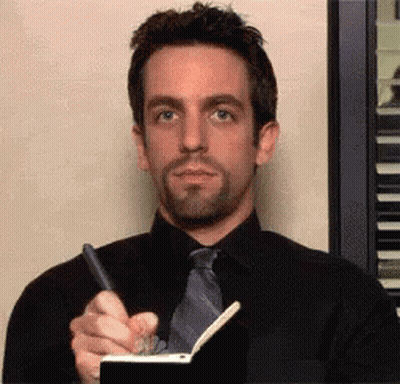Man In Black Shirt And Tie Writing On Notebook GIF