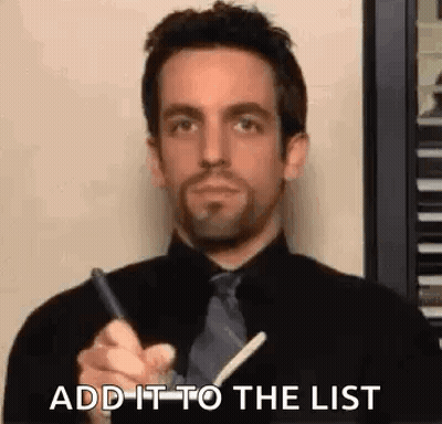 Man In Black Shirt And Tie Writing On Paper GIF