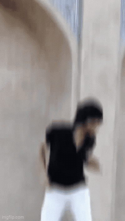 Man In Black Shirt And White Pants Dancing GIF