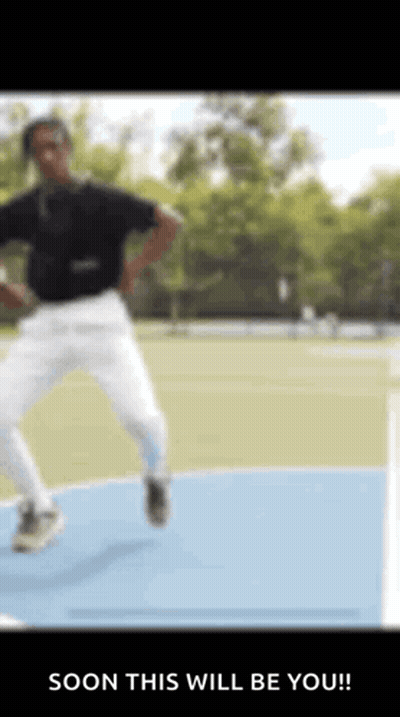 Man In Black Shirt And White Pants Jumping GIF