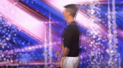 Man In Black Shirt And White Shorts On Stage GIF