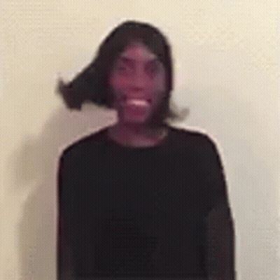 Man In Black Shirt And Wig Smiling GIF