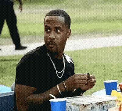 Man In Black Shirt At Table With Blue Cup GIF