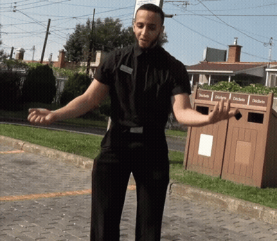 Man In Black Shirt By Trash Can Déchets GIF