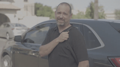Man In Black Shirt Carrying Backpack GIF