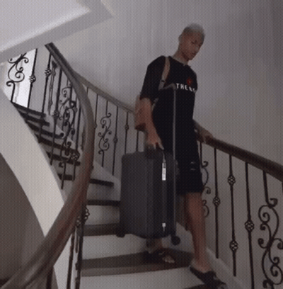 Man In Black Shirt Carrying Suitcase GIF