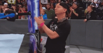 Man In Black Shirt Clapping At Wrestling Match GIF