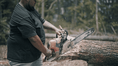 Man In Black Shirt Cutting Tree With Chainsaw GIF
