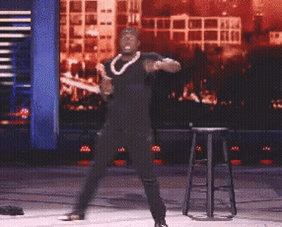 Man In Black Shirt Dancing On Stage GIF