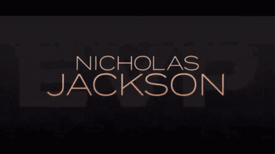 Man In Black Shirt Dancing With Microphone In Green Light GIF