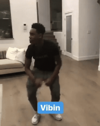 Man In Black Shirt Dancing With Vibin Sign GIF