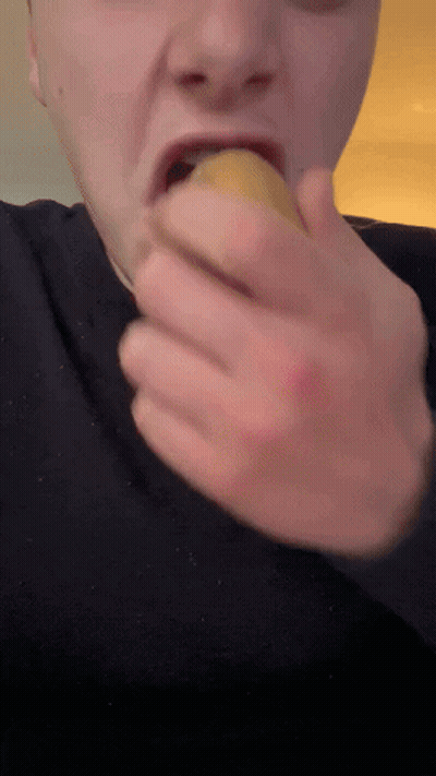 Man In Black Shirt Eating Banana GIF
