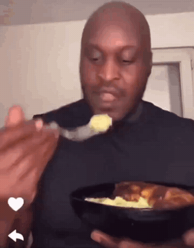 Man In Black Shirt Eating Food GIF