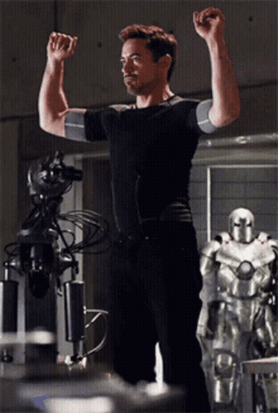 Man In Black Shirt Flexing Muscles GIF