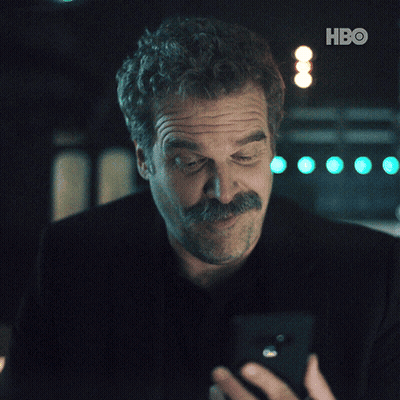 Man In Black Shirt Flexing Muscles GIF