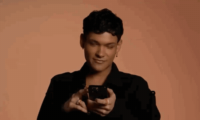 Man In Black Shirt Flipping Off With Phone GIF