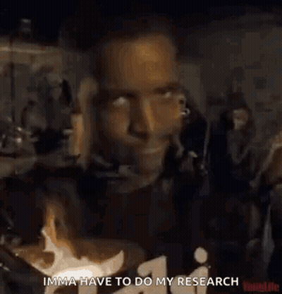Man In Black Shirt Giving Thumbs Up In Front Of Crowd GIF