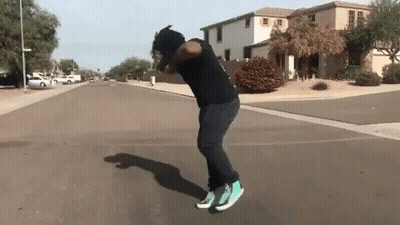 Man In Black Shirt Green Shoes Skateboard Trick GIF