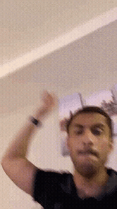 Man In Black Shirt Hand In Air GIF
