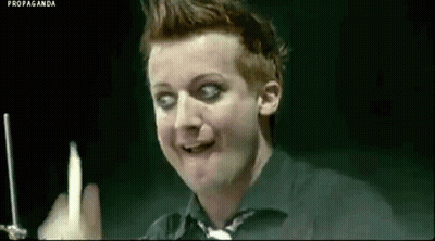 Man In Black Shirt Holding Candle Making Funny Face GIF