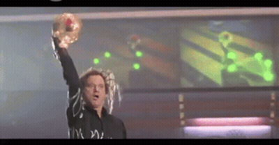 Man In Black Shirt Holding Donut GIF