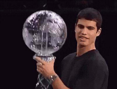 Man In Black Shirt Holding Glass Globe GIF