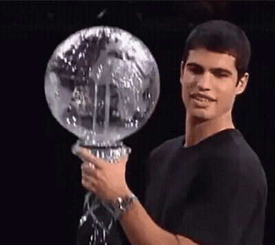Man In Black Shirt Holding Globe GIF