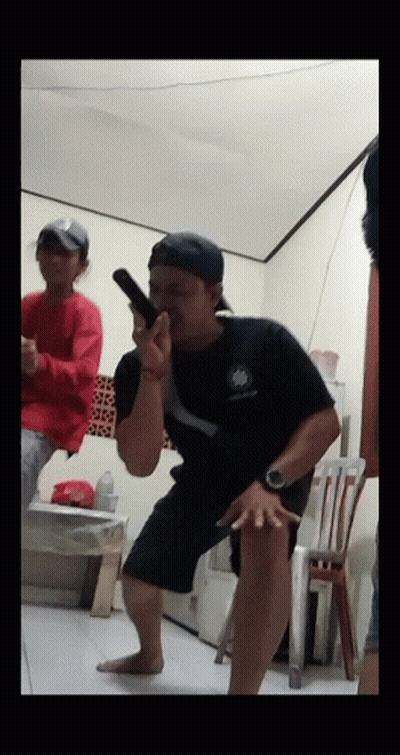 Man In Black Shirt Holding Gun GIF