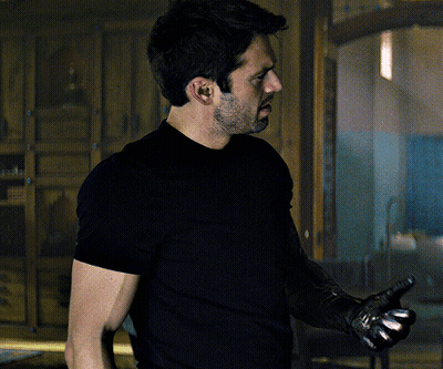Man In Black Shirt Holding Gun GIF