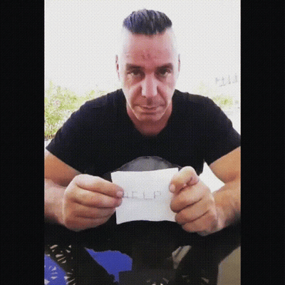 Man In Black Shirt Holding Help Paper GIF