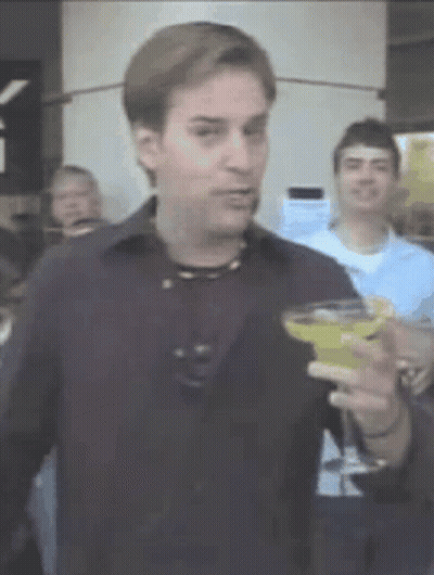Man In Black Shirt Holding Martini GIF