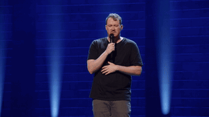 Man In Black Shirt Holding Microphone GIF