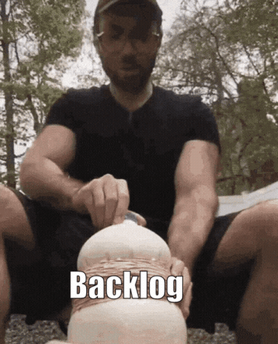 Man In Black Shirt Holding Object With Backlog GIF