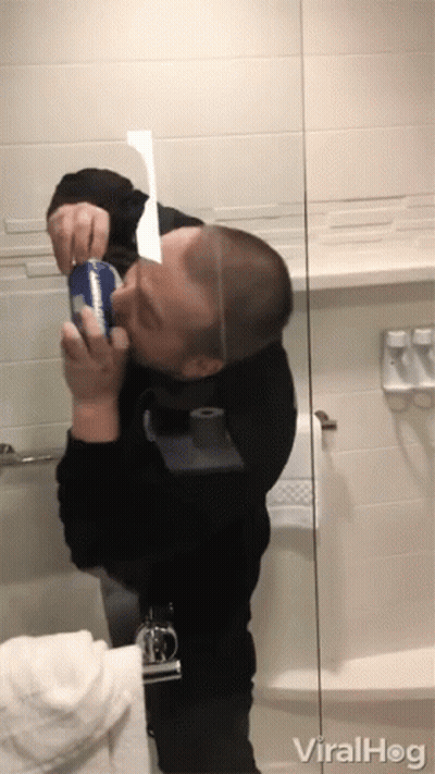 Man In Black Shirt Holding Pepsi In Front Of Bathroom Mirror GIF