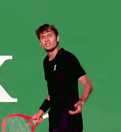 Man In Black Shirt Holding Tennis Racquet GIF