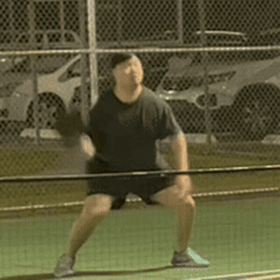 Man In Black Shirt Holding Tennis Racquet GIF