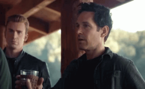 Man In Black Shirt Holding Wine GIF