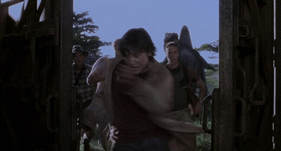 Man In Black Shirt Holding Woman In Purple Shirt GIF