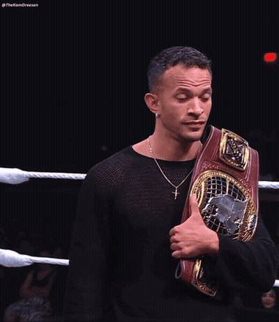Man In Black Shirt Holding Wrestling Belt GIF