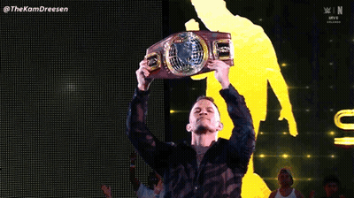 Man In Black Shirt Holding WWE Belt GIF