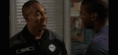 Man In Black Shirt Hugging Another Man GIF