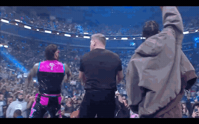 Man In Black Shirt In Crowd GIF