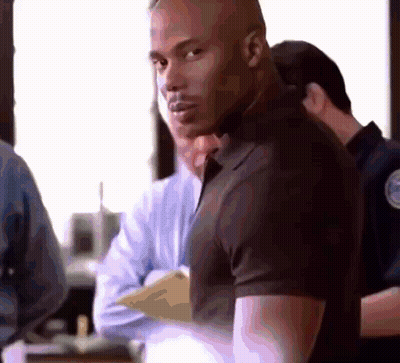 Man In Black Shirt In Crowd GIF